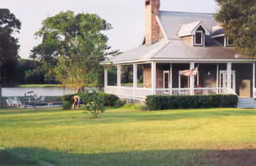 Ranch House with swimming pool and lake in background
